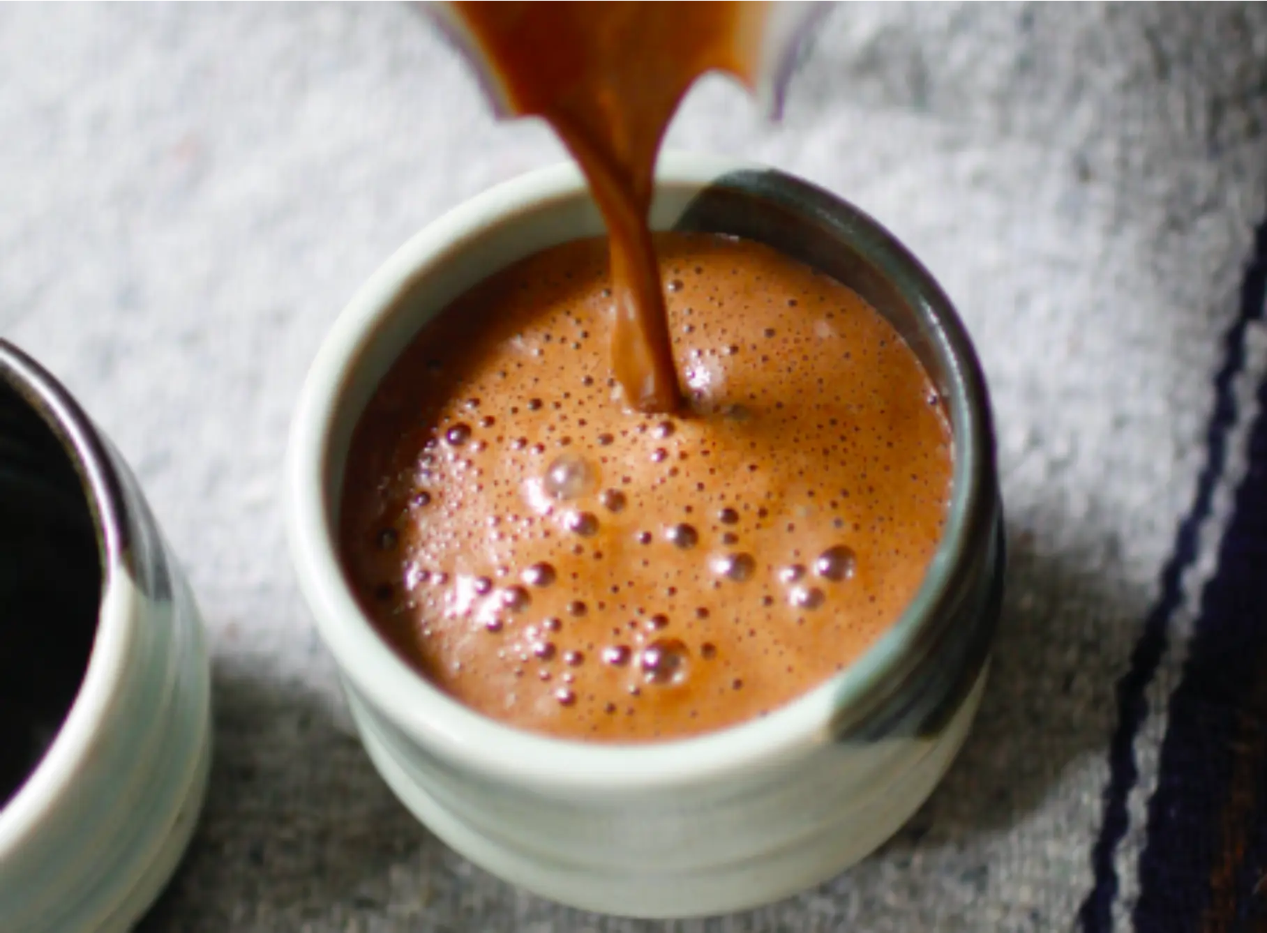 Cacao being poured into a cup